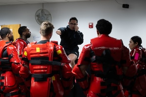 The Red Men are instructed in how to participate in the Red Man training exercise.
