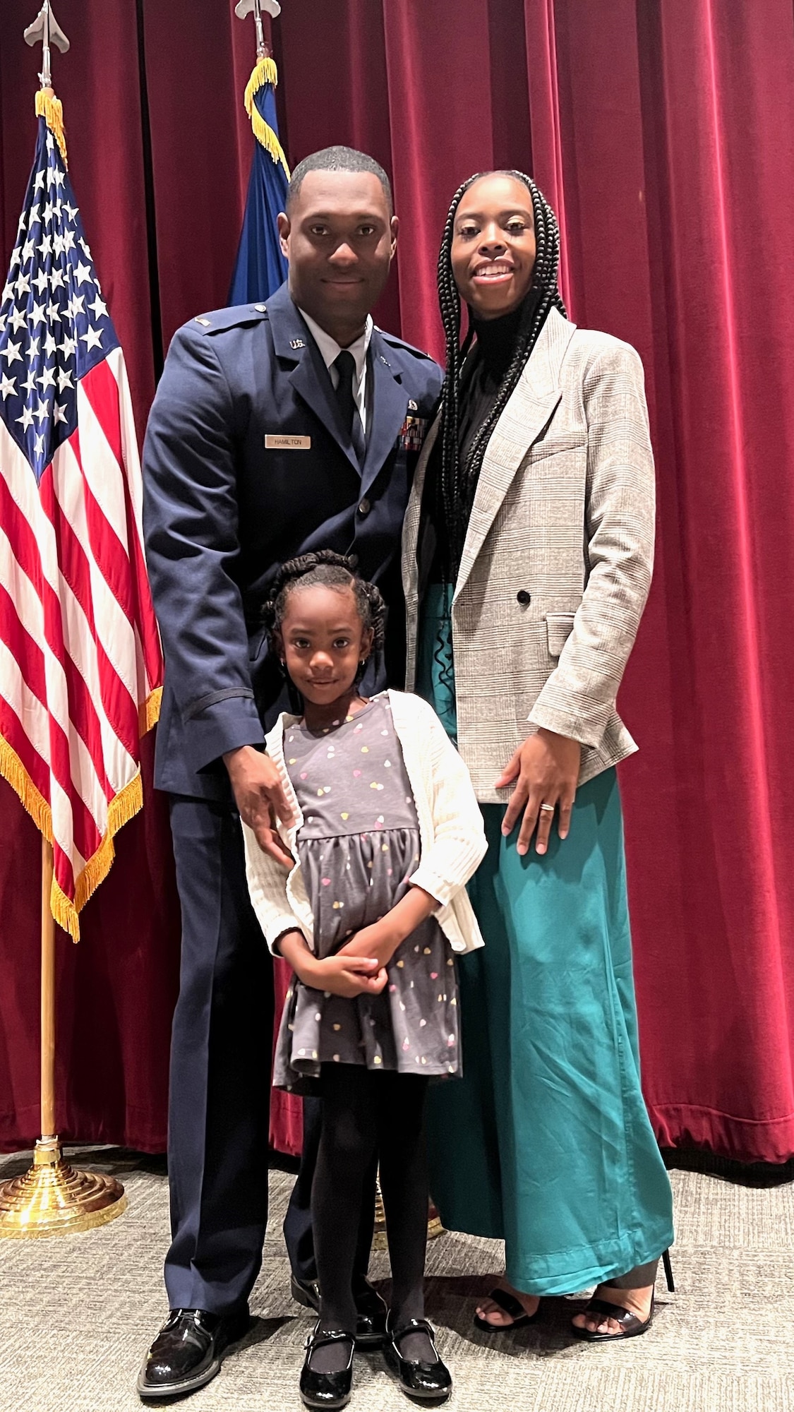 A mother and father with 7-year-old daughter
