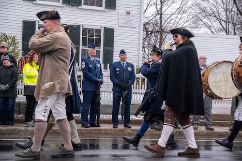Image of Airmen watching a parade.