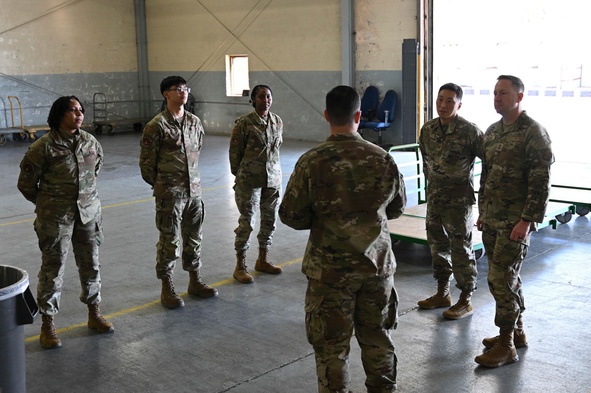 U.S. Airmen from the 316th Logistics Readiness Squadron are introduced during a visit from Col. Jun S. Oh, 316th Wing and installation commander, and Chief Master Sgt. Kevin W. Helms, 316th Wing command chief, at Joint Base Andrews, Md., April 9, 2025. The visit was part of the “Winnin’ Like a Griffin” recognition program, which highlights mission excellence across the wing. (U.S. Air Force photo by Senior Airman Gianluca Ciccopiedi)