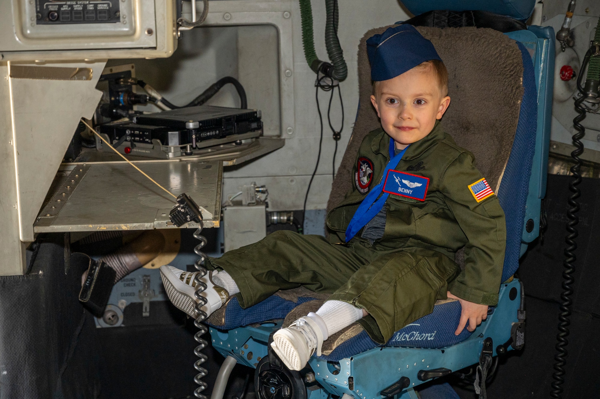 Benny Blankenship, the 2025 Team McChord pilot for a day, sits in a loadmaster seat aboard a C-17 Globemaster III at Joint Base Lewis-McChord, Washington, April 17, 2025.