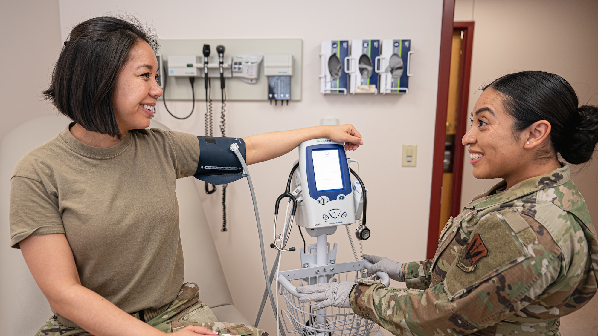 Staff Sgt. Yesica De Leon, non-commissioned officer in charge of the Warrior Operational Medicine Clinic for the 319th Operational Medical Readiness Squadron, removes a blood pressure cuff off of Capt. Holly Prouty, Aerospace Medicine Flight Commander for the 319th Operational Medical Readiness Squadron at Grand Forks Air Force Base, N.D., April 3, 2025. De Leon provides direct patient care for military members, dependent family members and veterans that report to the 319th Medical Group. (U.S. Air Force photo by Airman Nailah Pacheco)