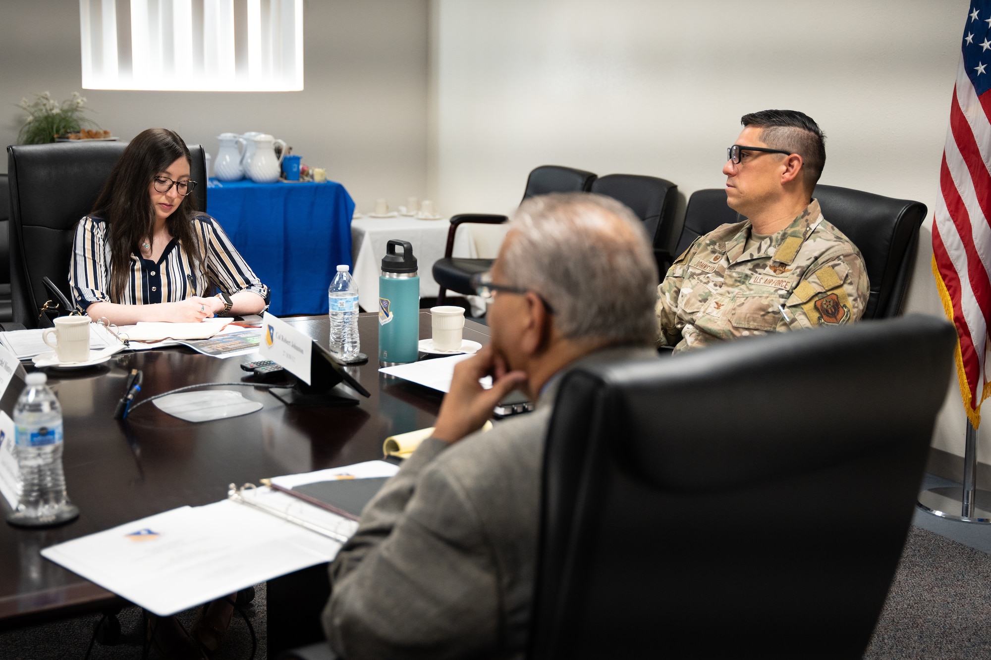 Rachel Montoya, left, policy advisor to congresswoman Teresa Leger Fernandez; U.S. Air Force Col. Robert Johnston, right, 27th Special Operations Wing commander; and Ben Salazar, local field representative to congresswoman Teresa Leger Fernandez, attend a mission brief at Cannon Air Force Base, New Mexico.