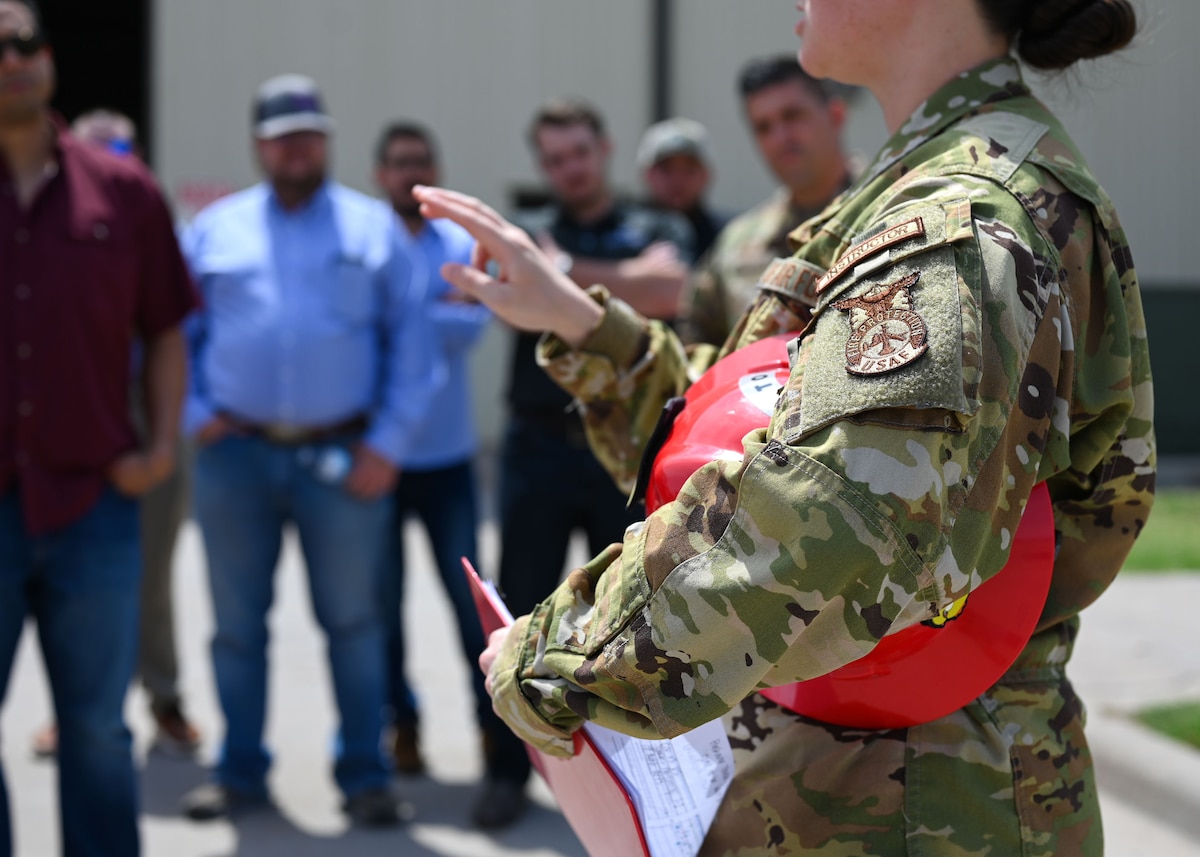 U.S. Air Force Tech. Sgt. Alyssa Poyner, 312th Training Squadron fire instructor, answers questions during the Leadership San Angelo Immersion at the Louis F. Garland Department of Defense Fire Academy, Goodfellow Air Force Base, Texas, April 17, 2025. The community relations-themed tour passed through the Louis F. Garland Department of Defense Fire Academy and discussed vehicles used for training daily, such as rescue trucks and airfield firefighting vehicles. (U.S. Air Force photo by Senior Airman Evelyn J. D’Errico)