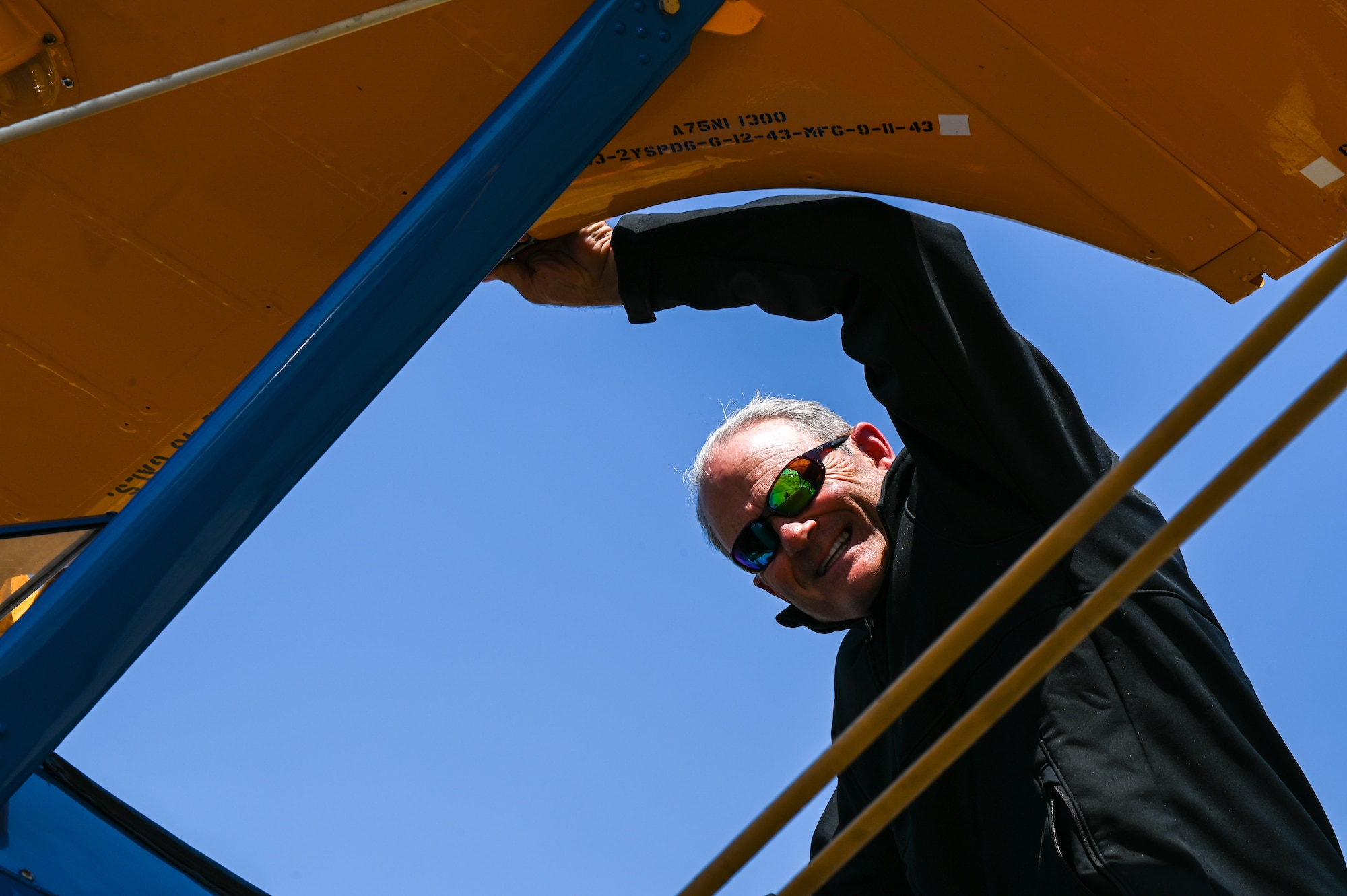Butch Cole, Commemorative Air Force PT-17 Stearman pilot, exits a P-17 after landing at Maxwell Air Force Base, Alabama, April 17, 2025.
