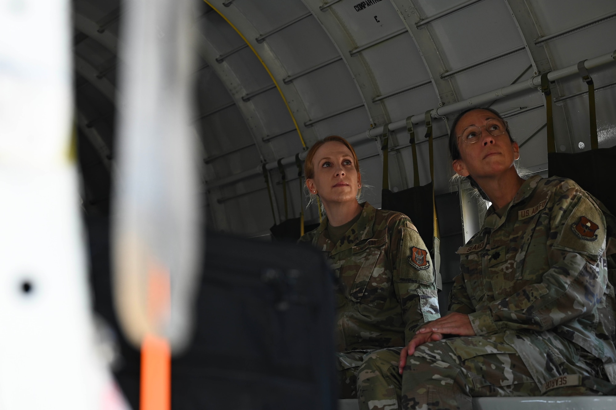 U.S. Air Force Maj. Theresa Eckard, left, Air University director of operations, and Lt. Col. Andrea Searor, right, AU chief of international affairs, sit in a Commemorative Air Force “Ready 4 Duty” Douglas R4D-6S at Maxwell Air Force Base, April 17, 2025.