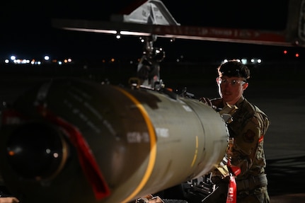 U.S. Air Force Airman 1st Class Kaden Brewer, 96th Bomb Squadron weapons load crew member, transfers a CBU-105, or cluster bomb unit, from a munitions trailer to a MJ-1 “jammer” for loading onto a B-52H Stratofortress