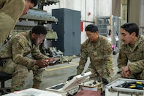 U.S. Air Force Airmen with the 2nd Munitions Squadron prepare to operate testing equipment for munitions