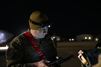 Staff Sgt. Cole Greer, 96th Bomb Squadron weapons load crew chief, goes over inspection items for munitions