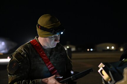 Staff Sgt. Cole Greer, 96th Bomb Squadron weapons load crew chief, goes over inspection items for munitions