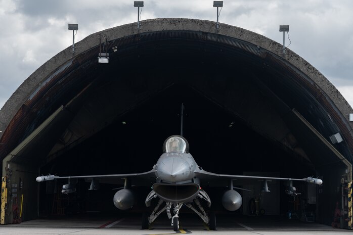 An F-16 in a shelter.