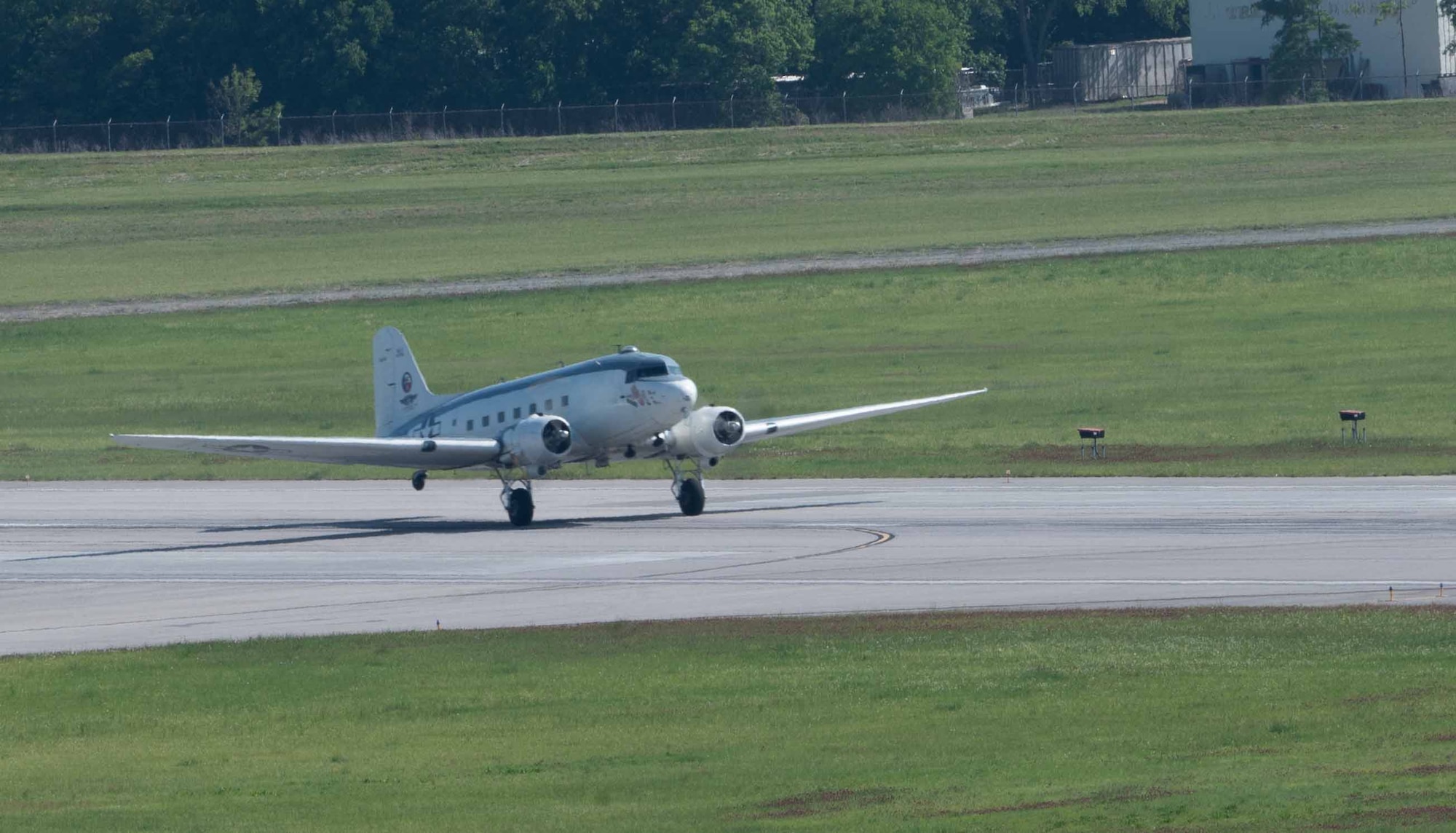 The Commemorative Air Force “Ready 4 Duty” Douglas R4D-6S, a historic U.S. Navy variant of the Douglas C-47 Skytrain, lands at Maxwell Air Force Base, Alabama, on April 17, 2025.