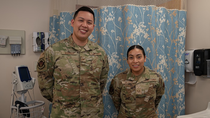 Staff Sgt. Patrick Norindr, bioenvironmental engineering flight chief for the 319th Operational Medical Readiness Squadron and Staff Sgt. Yesica De Leon, non-commissioned officer in charge of the Warrior Operational Medicine Clinic for the 319th Operational Medical Readiness Squadron, pose for a photo at Grand Forks Air Force Base, N.D., April 3, 2025. Norindr and De Leon were both accepted into the Nurse Enlisted Commissioning Program and will begin their Bachelor’s of Science in Nursing programs this fall before commissioning as active duty nurses. (U.S. Air Force photo by Airman Nailah Pacheco)