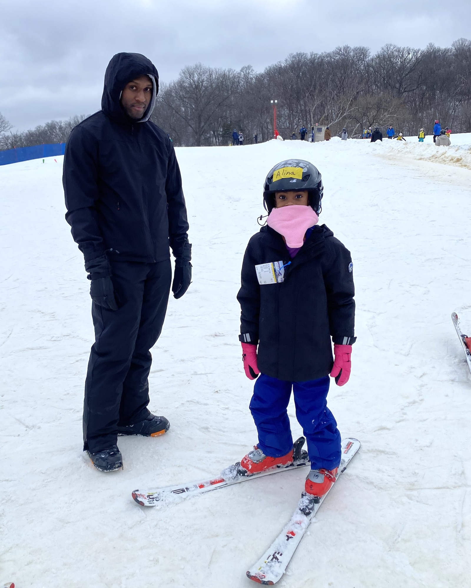 A mother and father with 7-year-old daughter, and her grandmother