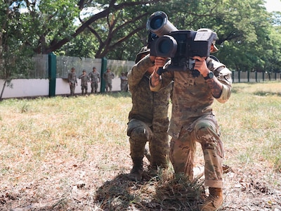 Philippine Army soldiers and U.S. Army Soldiers assigned to CDE Company, 1st Battalion, 21st Infantry Regiment, 2nd Infantry Brigade Combat Team, 25th Infantry Division, conduct hands-on training with the Javelin missile system during an Anti-Armor Subject Matter Expert Exchange (SMEE) at Fort Magsaysay, Philippines, March 25, 2025.