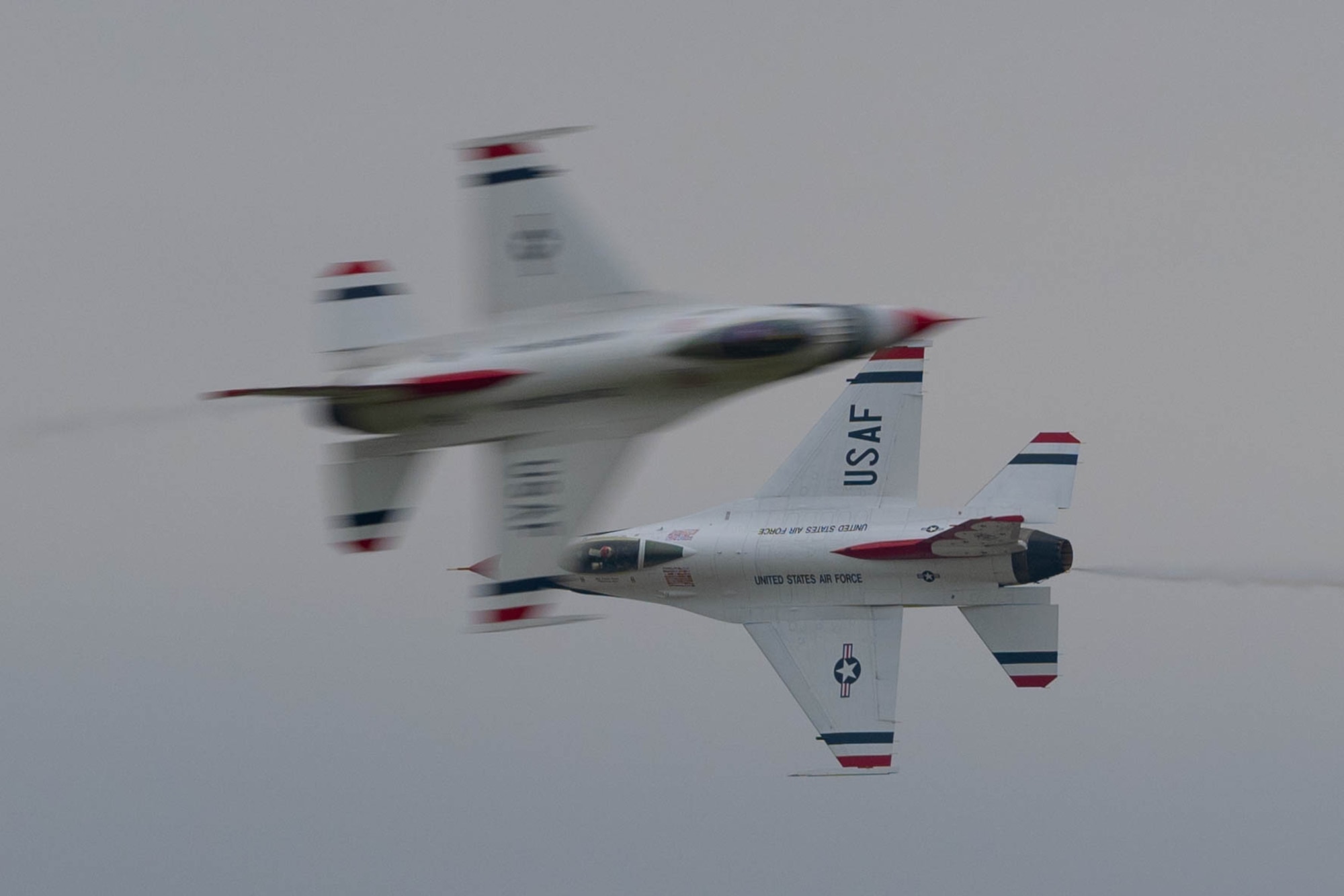 Two F-16 fly in the air