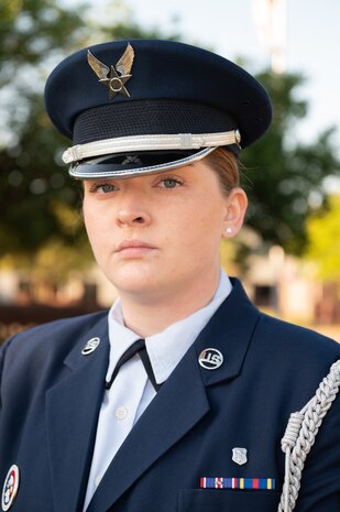Female Airman posing for portrait shot outdoors.