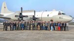 Current and former employees who have supported the EP-3E ARIES II aircraft over the many years stand with the last EP-3 at NAS Patuxent River before the aircraft heads home to NAS Whidbey Island on Nov. 5.