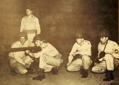 A 57 mm recoilless rifle squad from the Rome-based Company E, 122nd Infantry Regiment secures an intersection during exercises as part of Operation Minuteman April 20, 1955.