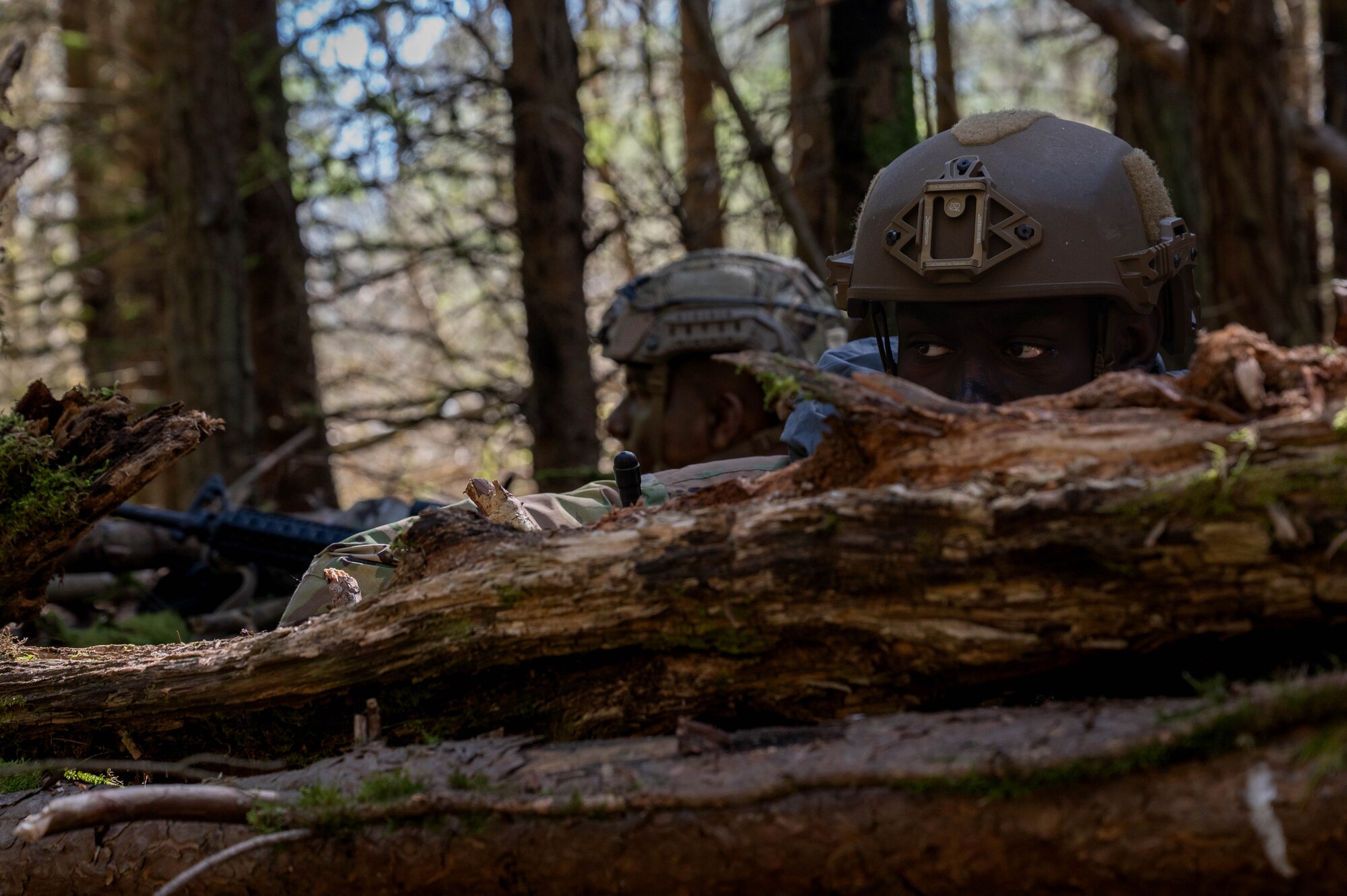 Two men pull security at a defensive position