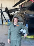 Lt. Keven Humphreys, one of the last two naval aviators to
qualify to operate the MH-53E Sea Dragon, stands next to an
aircraft.