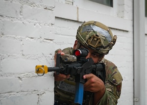 Staff Sgt. Gianfranco Guevara, 55th Security Forces Squadron defender, secures his position during exercise Iron Lightning 25-2 and as part of a combat readiness inspection at Camp Ashland, Nebraska, April 2. The CRI was implemented in conjunction with Iron Lightning 25-2 and was the biggest exercise in Offutt's history. (U.S. Air Force photo by Daniel Martinez)