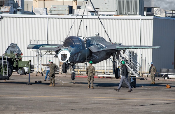 Marines with Marine Wing Support Squadron 271 (MWSS-271), based at Marine Corps Air Station Cherry Point, train with Fleet Readiness Center East (FRCE) artisans and engineers to learn proper crane lifting techniques for the F-35B Lightning II aircraft. The crane lift was one phase of a three-day training event that simulated the recovery of a downed F-35 with collapsed front landing gear. FRCE assisted the squadron by providing access to a stripped-down F-35 airframe used for training and testing at the depot, which allowed the Marines to practice recovering a damaged F-35 without risking harm to an operational aircraft.