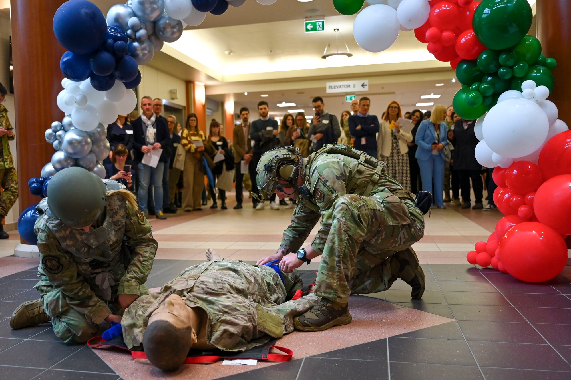 Staff Sgt. Christian Baker and Staff Sgt. Ryan McHone performing TCCC on a training mannequin.