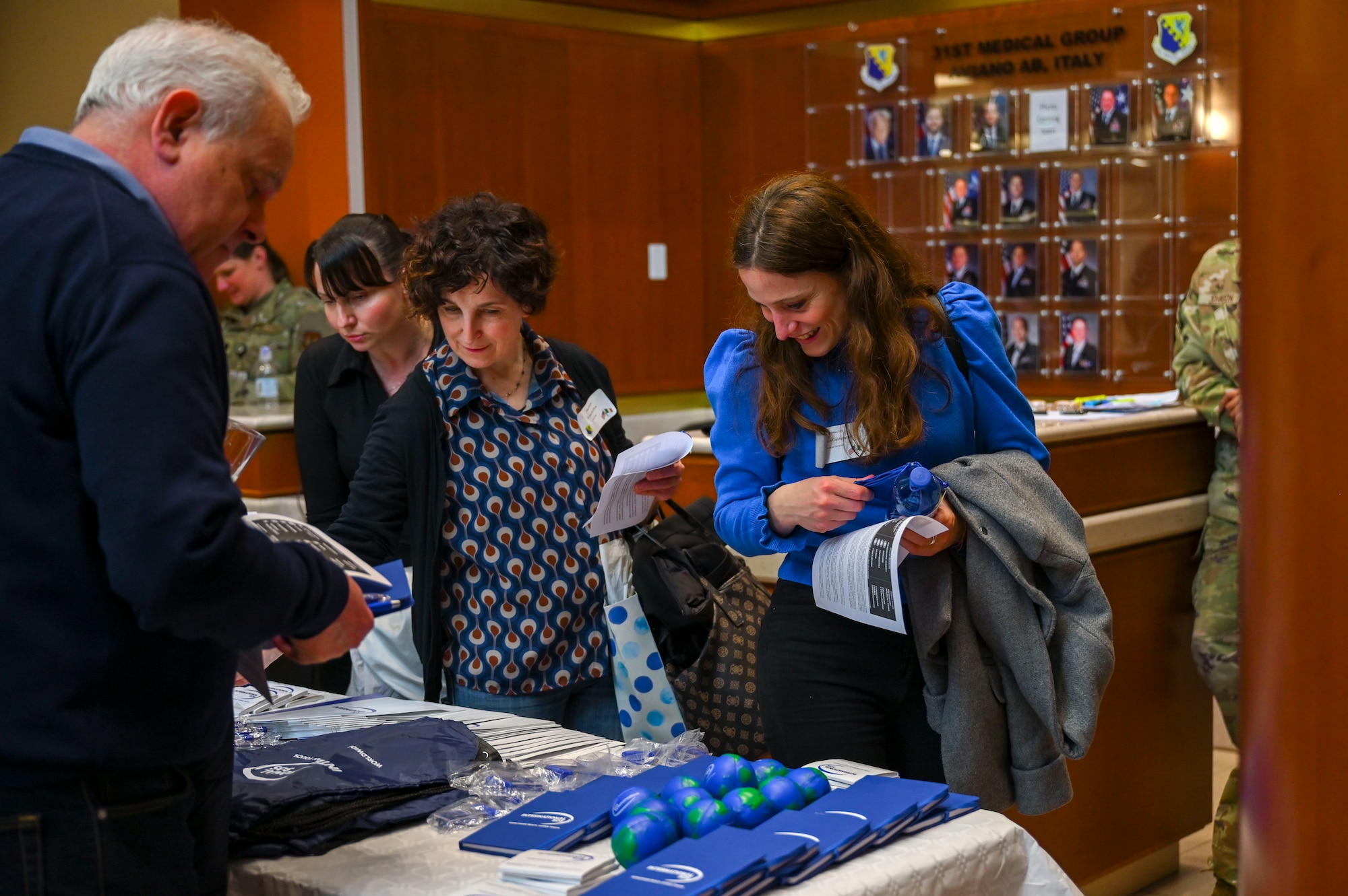 Italian host nation medical professionals looking an International SOS booth.