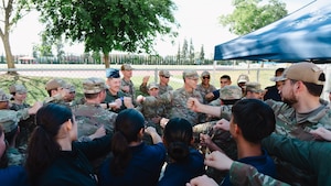 Maj. Gen. Scott A. Cain, AFTC commander, smiles with AFROTC Det. 035 cadets during a LLAB on April 10, 2025. Cain's visit highlighted the importance of senior leadership focusing on mentoring the future of the force.