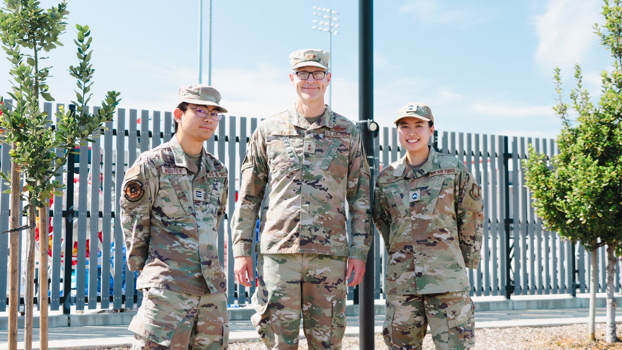 From left, cadet David Nguyen, Maj. Gen. Scott A. Cain, AFTC commander and cadet Vivian Nguyen pose for a photo together. Both cadets were part of a contracting ceremony held April 10, 2025 during Cain's visit to Det 035.