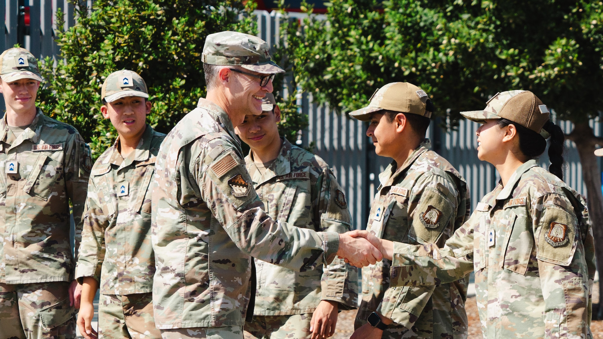 Maj. Gen. Scott A. Cain, AFTC commander, left, shakes the hand of a AFROTC Det. 035 cadet, April 10, 2025. Cain spent the day engaging with Det. 035 cadets and promoting awareness of the responsibilities of being a leader in the USAF.