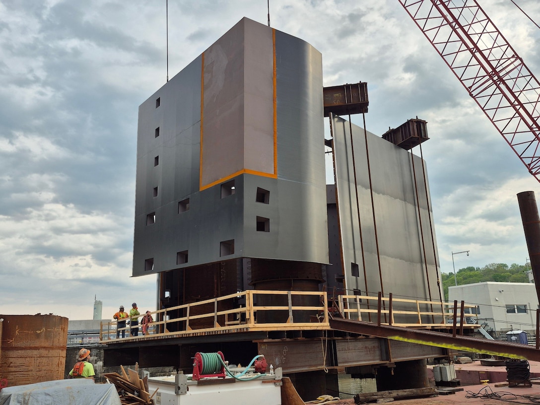 A landside nose pier shell is lifted into place around drilled shafts after being delivered to the Chickamauga Lock site on April 5, 2025, in Chattanooga, Tennessee.
