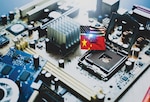 Chip shortage and US-China trade conflict. Global chip shortage crisis and China-United States trade war concept. China flag and US flag on computer on chip electronic circuit board. Computer hardware.