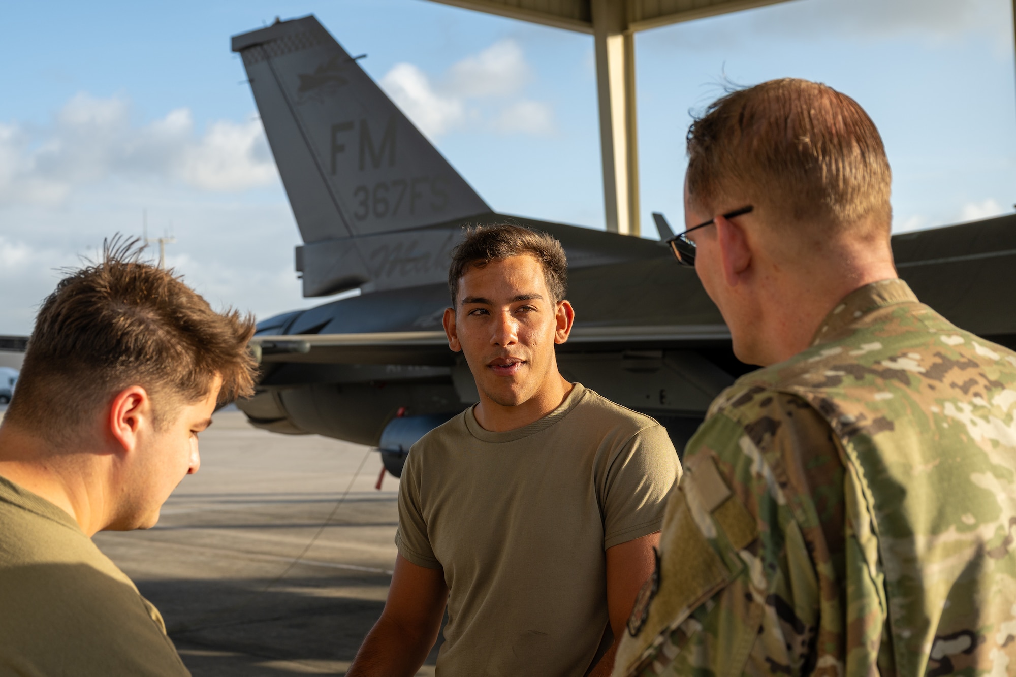 Senior Airman Brandon Azocar, a crew chief assigned to the 482d Maintenance Squadron, talks with fellow maintainers before launching an F-16 Fighting Falcon at Homestead Air Reserve Base, Fla., April 4, 2025. Azocar, a traditional reservist, prepared and launched the first F-16 bearing the “367FS” tail flash. (U.S. Air Force photo by Master Sgt. Lionel Castellano)