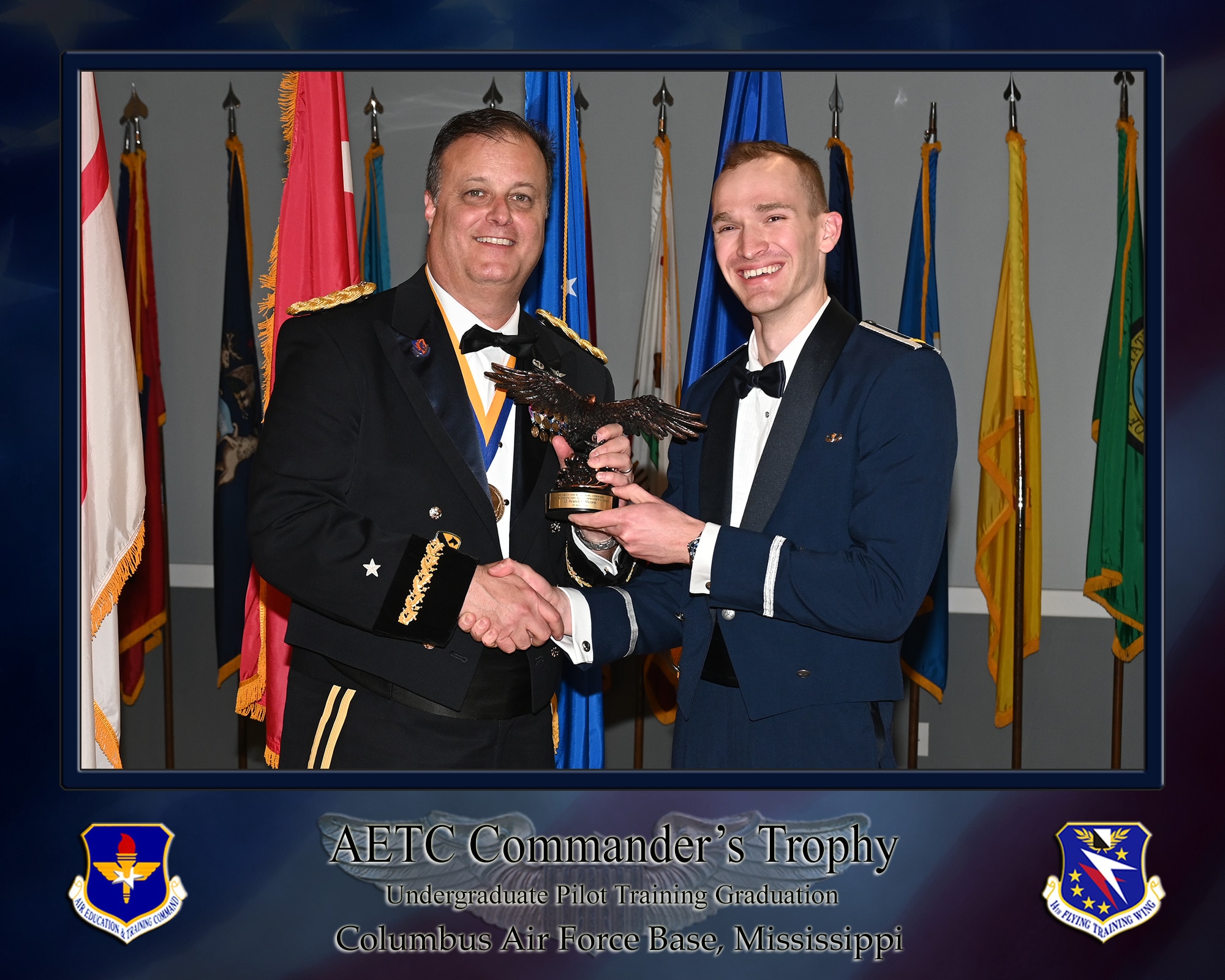 Brigadier General Andrew S. Rendon, and 2d Lt Brandon E. Alcorn, UPT graduate, pose for a photo with the Air Education and Training Command commander’s trophy during a combined graduation ceremony on April 18, 2025, at the Event Center on Columbus Air Force Base, Miss. (U.S. Air Force photo by Elizabeth Owens)
