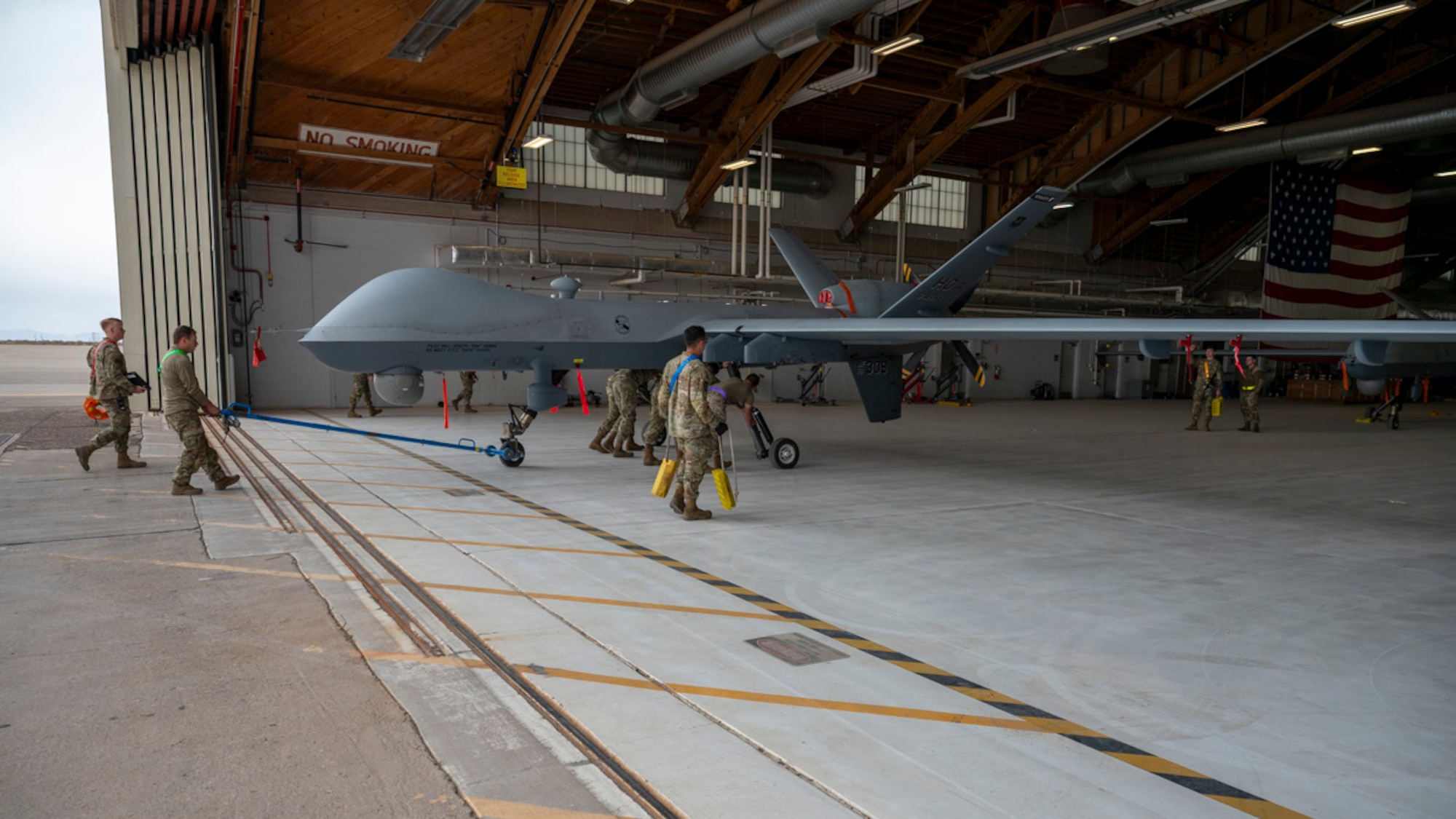 Airmen of the 849th Aircraft Maintenance Squadron taxi in an MQ-9 Reaper at Holloman Air Force Base, New Mexico, April 2, 2025. Project Iron Agility brings together logistics, maintenance, and operations personnel in a realistic, multi-phase exercise that tests their ability to sustain combat operations under pressure. (U.S. Air Force photo by Senior Airman Michelle Ferrari)