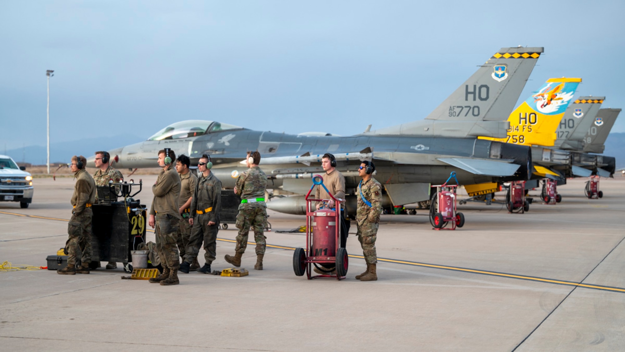 Airmen of the 49th Logistics Readiness Squadron, the49th Aircraft Maintenance Squadron, and the 849th AMXS prepare F-16 Fighting Falcons and MQ-9 Reapers for Project Iron Agility nighttime operations at Holloman Air Force Base, New Mexico, April 3, 2025. Project Iron Agility is a dynamic training exercise designed to sharpen Airmen's deployment readiness skills through agile operations featuring F-16s, MQ-9s, and integrated logistics support. (U.S. Air Force photo by Senior Airman Michelle Ferrari)
