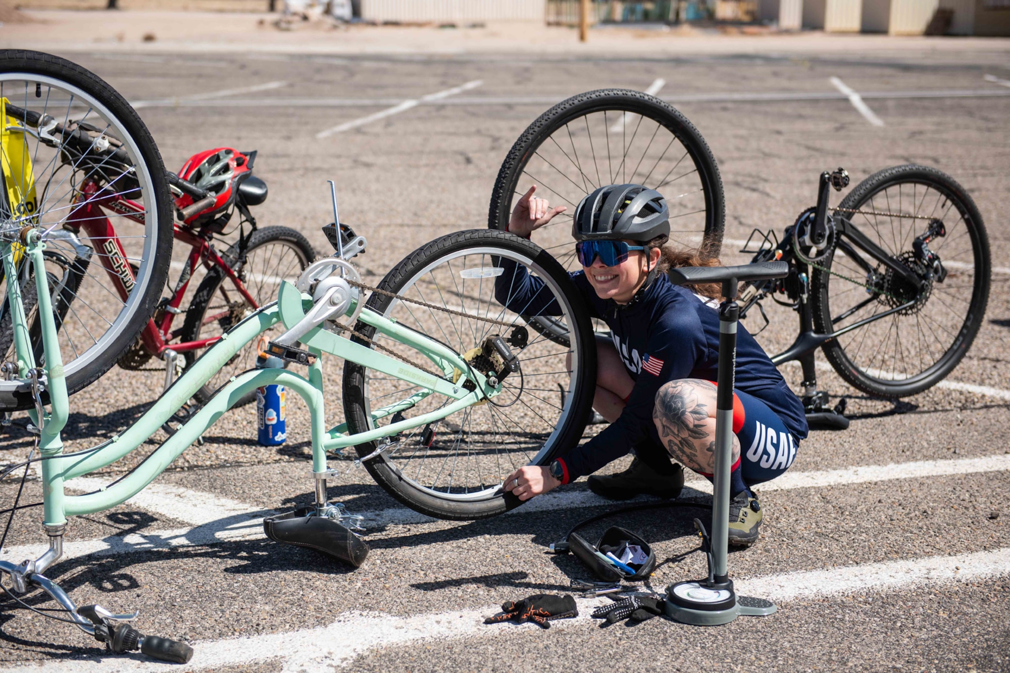 Woman fixes bike tire