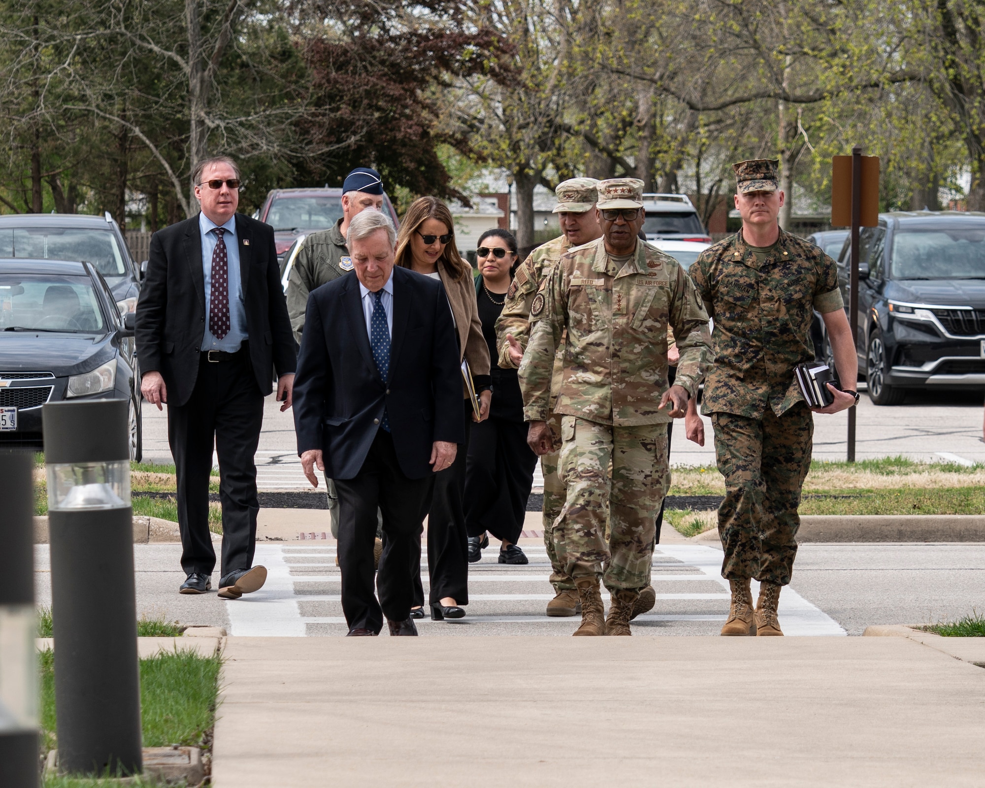 Illinois Sen. Dick Durbin speaks to Gen. Randall Reed, U.S. Transportation Command (USTC) commander, Brig. Gen. Corey Simmons, Air Mobility Command Strategy, Plans, Requirements and Programs director, and Col. Jeffrey Smith, 932nd Airlift Wing commander, during Durbin’s visit to the 932nd AW, Scott AFB, Illinois, April 14, 2025.  During his visit, Durbin was updated on 932nd AW distinguished visitor airlift missions, USTC mission and challenges facing USTRANSCOM and the USTC air component, Air Mobility Command.  (U.S. Air Force photo by Brooke Spenner)