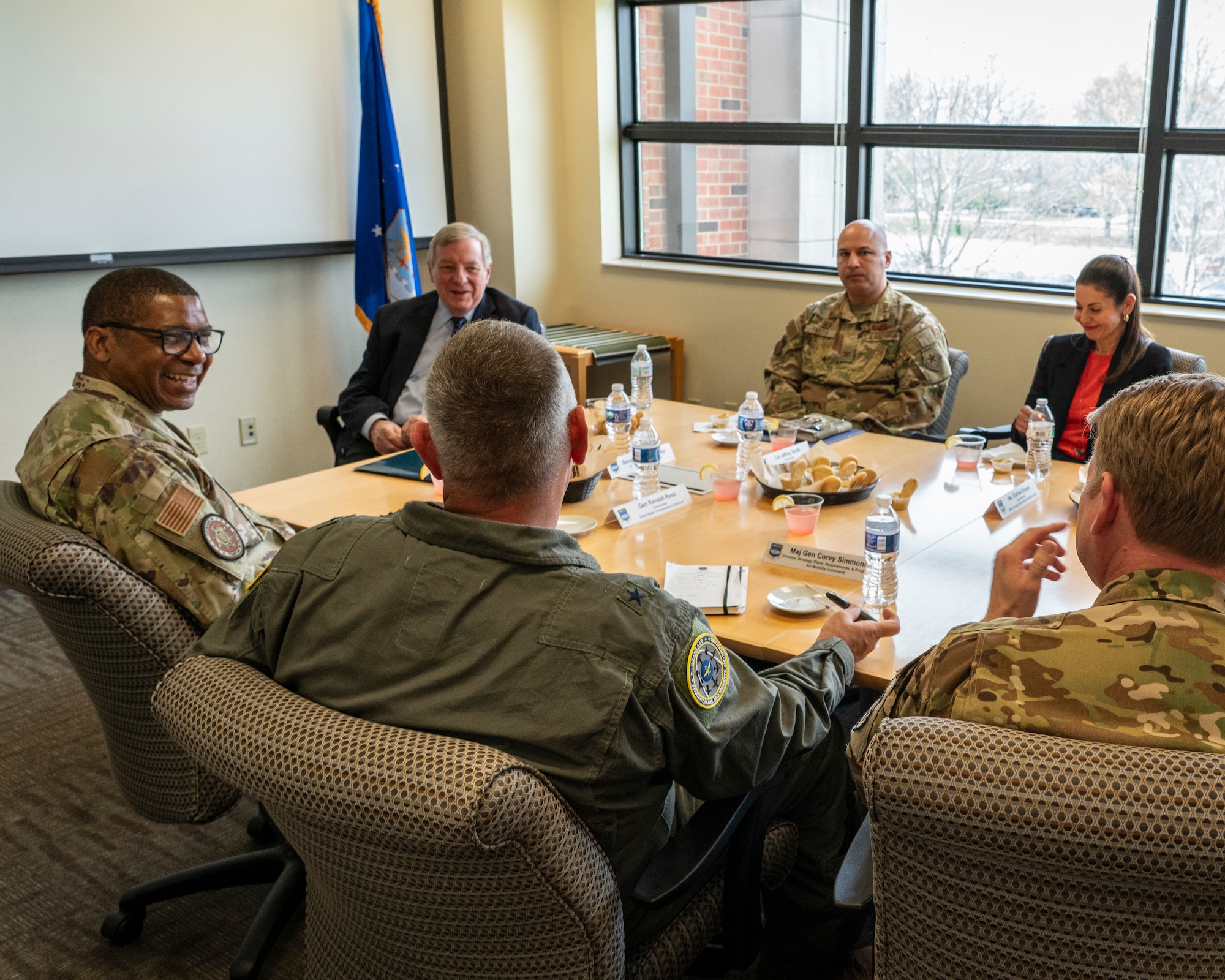 Illinois Sen. Dick Durbin speaks to Gen. Randall Reed, U.S. Transportation Command (USTC) commander, Brig. Gen. Corey Simmons, Air Mobility Command Strategy, Plans, Requirements and Programs director, and Col. Jeffrey Smith, 932nd Airlift Wing commander, during Durbin’s visit to the 932nd AW, Scott AFB, Illinois, April 14, 2025.  During his visit, Durbin was updated on 932nd AW distinguished visitor airlift missions, USTC mission and challenges facing USTRANSCOM and the USTC air component, Air Mobility Command.  (U.S. Air Force photo by Brooke Spenner)