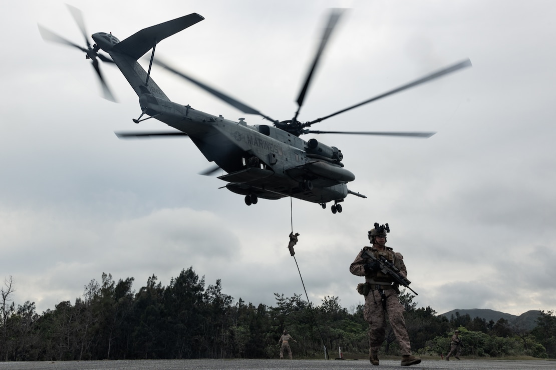 U.S. Marines with Maritime Raid Force, 31st Marine Expeditionary Unit, fast-rope from a U.S. Marine Corps CH-53E Super Stallion assigned to Marine Medium Tiltrotor Squadron 265 (Rein.), during alternate insertion and extraction training on Landing Zone Swallow at Camp Hansen, Okinawa, Japan, April 18, 2025.