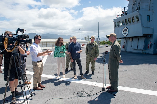 CAIRNS, Australia (April 16, 2025) – Capt. Nicholas DeLeo, commanding officer of the U.S. 7th Fleet flagship USS Blue Ridge (LCC 19), speaks with members of the Australian media on the ship’s flight deck during a scheduled port visit in Cairns, Australia, April 16, 2025. The Blue Ridge and embarked U.S. 7th Fleet staff conduct regular Indo-Pacific patrols to deter aggression, strengthen alliances and partnerships, and advance future warfighting capabilities. (U.S. Navy photo by Mass Communication Specialist Seaman Nicholas Douglass.)