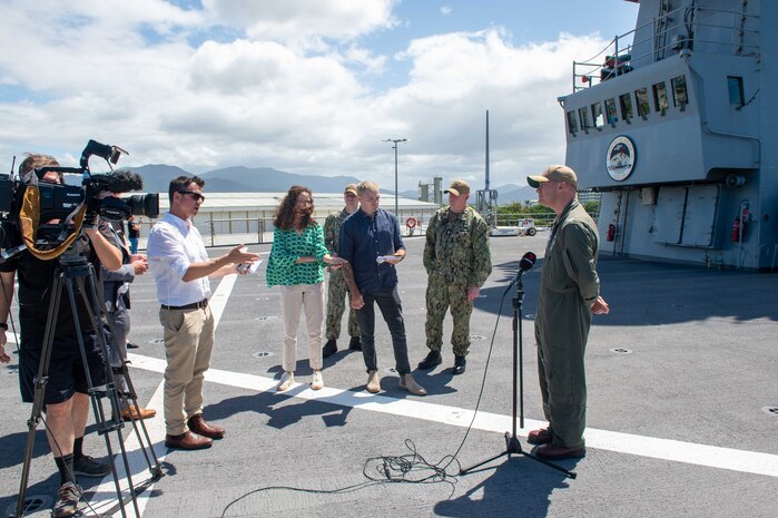 CAIRNS, Australia (April 16, 2025) – Capt. Nicholas DeLeo, commanding officer of the U.S. 7th Fleet flagship USS Blue Ridge (LCC 19), speaks with members of the Australian media on the ship’s flight deck during a scheduled port visit in Cairns, Australia, April 16, 2025. The Blue Ridge and embarked U.S. 7th Fleet staff conduct regular Indo-Pacific patrols to deter aggression, strengthen alliances and partnerships, and advance future warfighting capabilities. (U.S. Navy photo by Mass Communication Specialist Seaman Nicholas Douglass.)