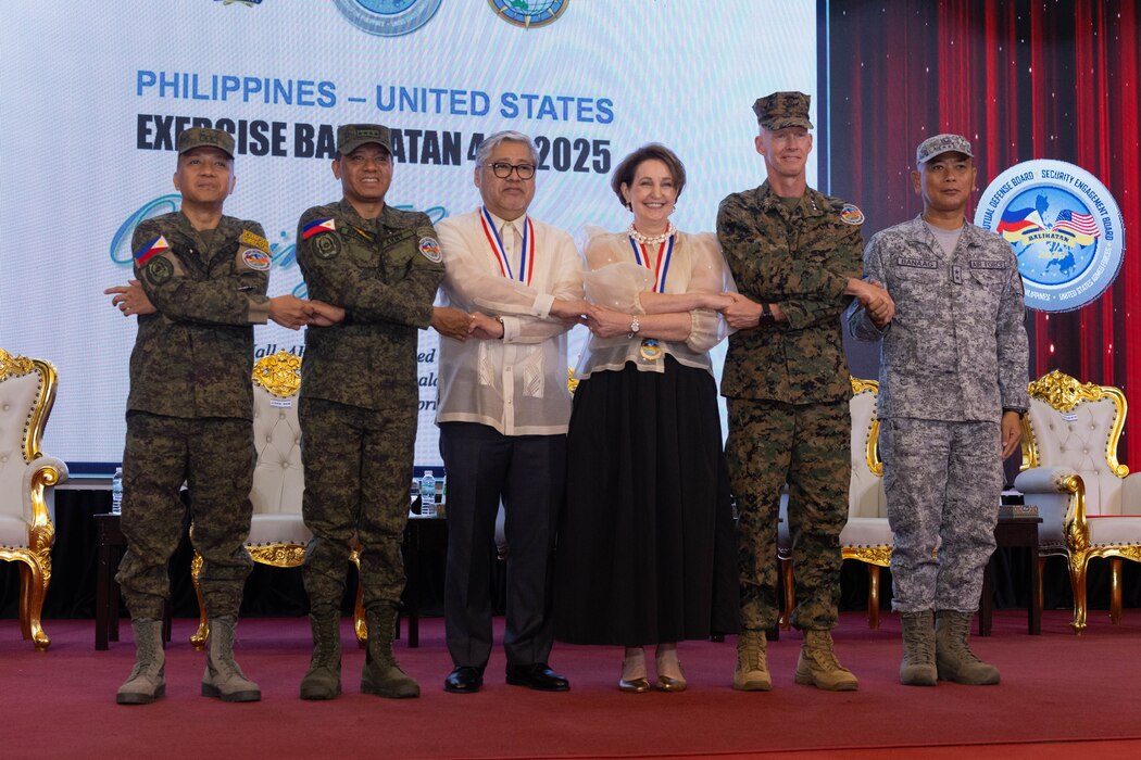Philippine and U.S. government and military representatives conduct the “crossing of hands” during the opening ceremony to commence Exercise Balikatan 25 at Camp Aguinaldo, Manila, Philippines, April 21, 2025.