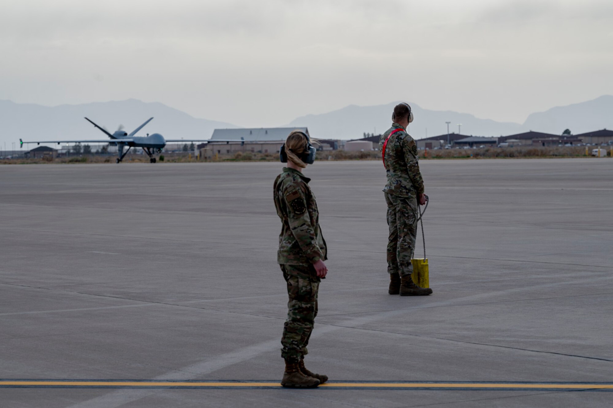 Airmen of the 849th Aircraft Maintenance Squadron taxi in an MQ-9 Reaper at Holloman Air Force Base, New Mexico, April 2, 2025. Aligned with the Agile Combat Employment concept, Project Iron Agility trains Airmen to operate under austere and evolving conditions, emphasizing quick decision-making and decentralized command. (U.S. Air Force photo by Senior Airman Michelle Ferrari)