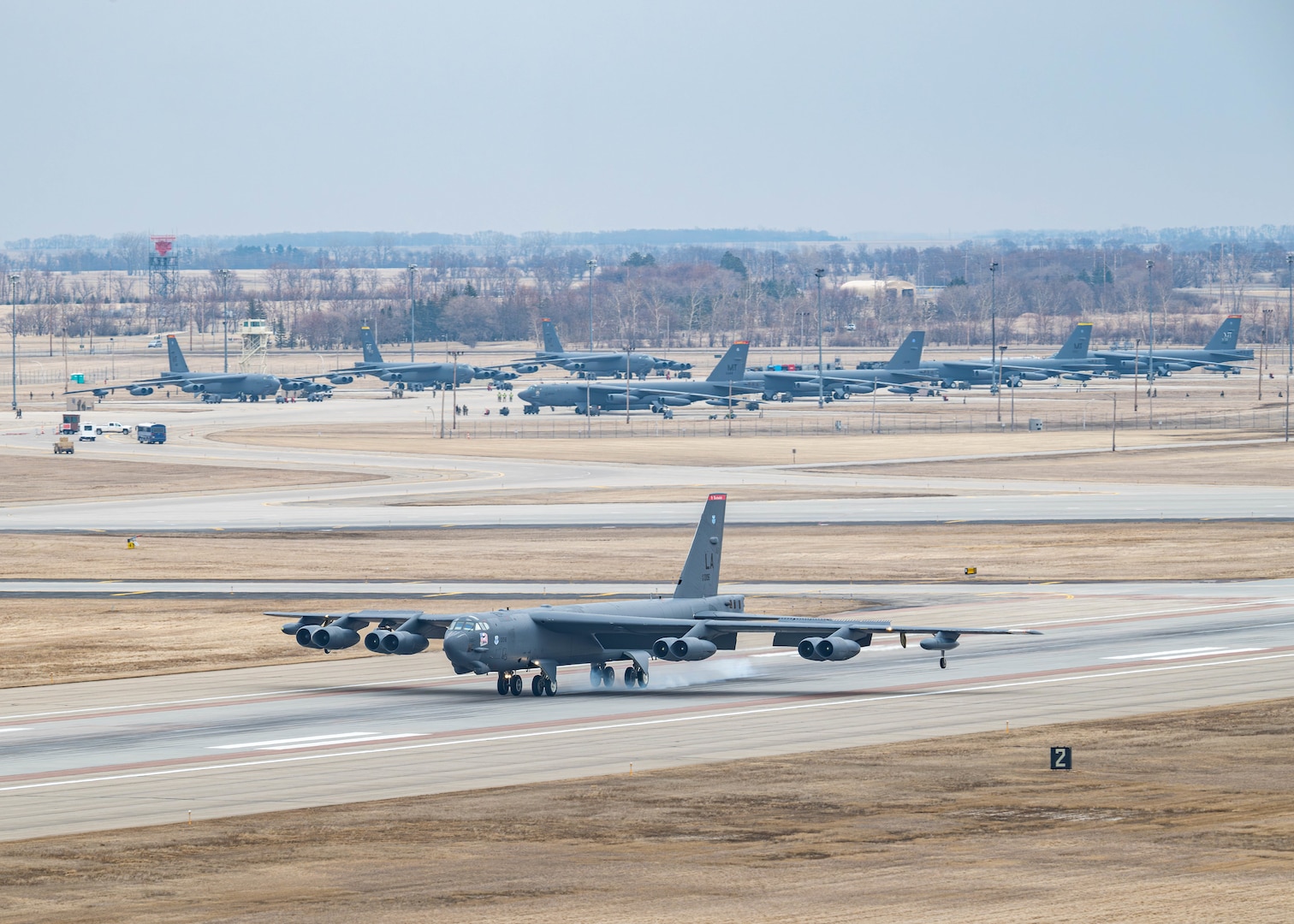 A U.S. Air Force B-52H Stratofortress assigned to the 96th Bomb Squadron, Barksdale Air Force Base, Louisiana, lands on the runway for Exercise Prairie Vigilance 25-1 at Minot Air Force Base, North Dakota, April 9, 2025. As a routine training mission, Prairie Vigilance enhances the safety, security and reliability of the bomber leg of the U.S. nuclear triad. (U.S. Air Force photo by Senior Airman Kyle Wilson)