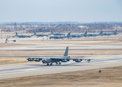 A U.S. Air Force B-52H Stratofortress assigned to the 96th Bomb Squadron, Barksdale Air Force Base, Louisiana, lands on the runway for Exercise Prairie Vigilance 25-1 at Minot Air Force Base, North Dakota, April 9, 2025. As a routine training mission, Prairie Vigilance enhances the safety, security and reliability of the bomber leg of the U.S. nuclear triad. (U.S. Air Force photo by Senior Airman Kyle Wilson)