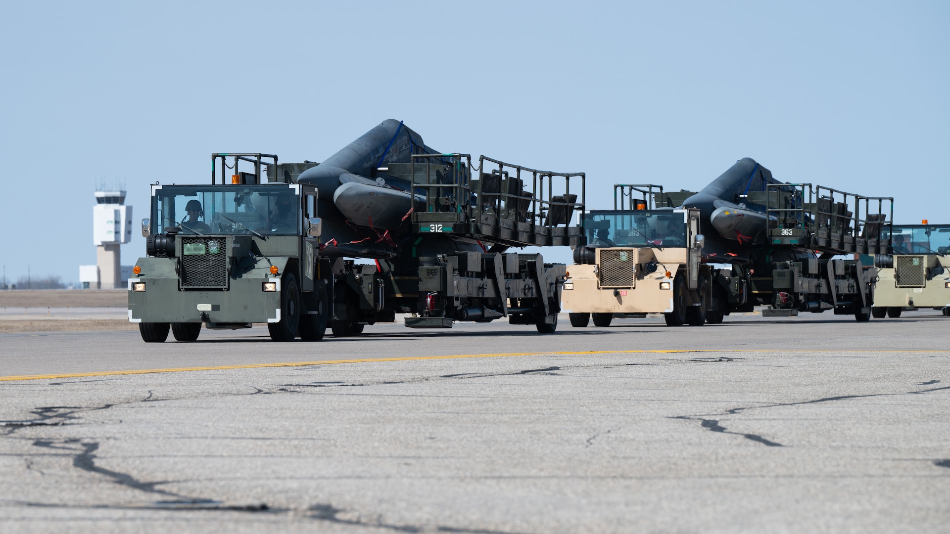 Airmen assigned to the 705th Munitions Squadron conduct convoy operations during Prairie Vigilance/Bayou Vigilance 25-1 at Minot Air Force Base, North Dakota, April 11, 2025. As routine training missions, Prairie Vigilance enhances the safety, security and reliability of the bomber leg of the U.S. nuclear triad. (U.S. Air Force photo by Senior Airman Kendra A. Ransum)