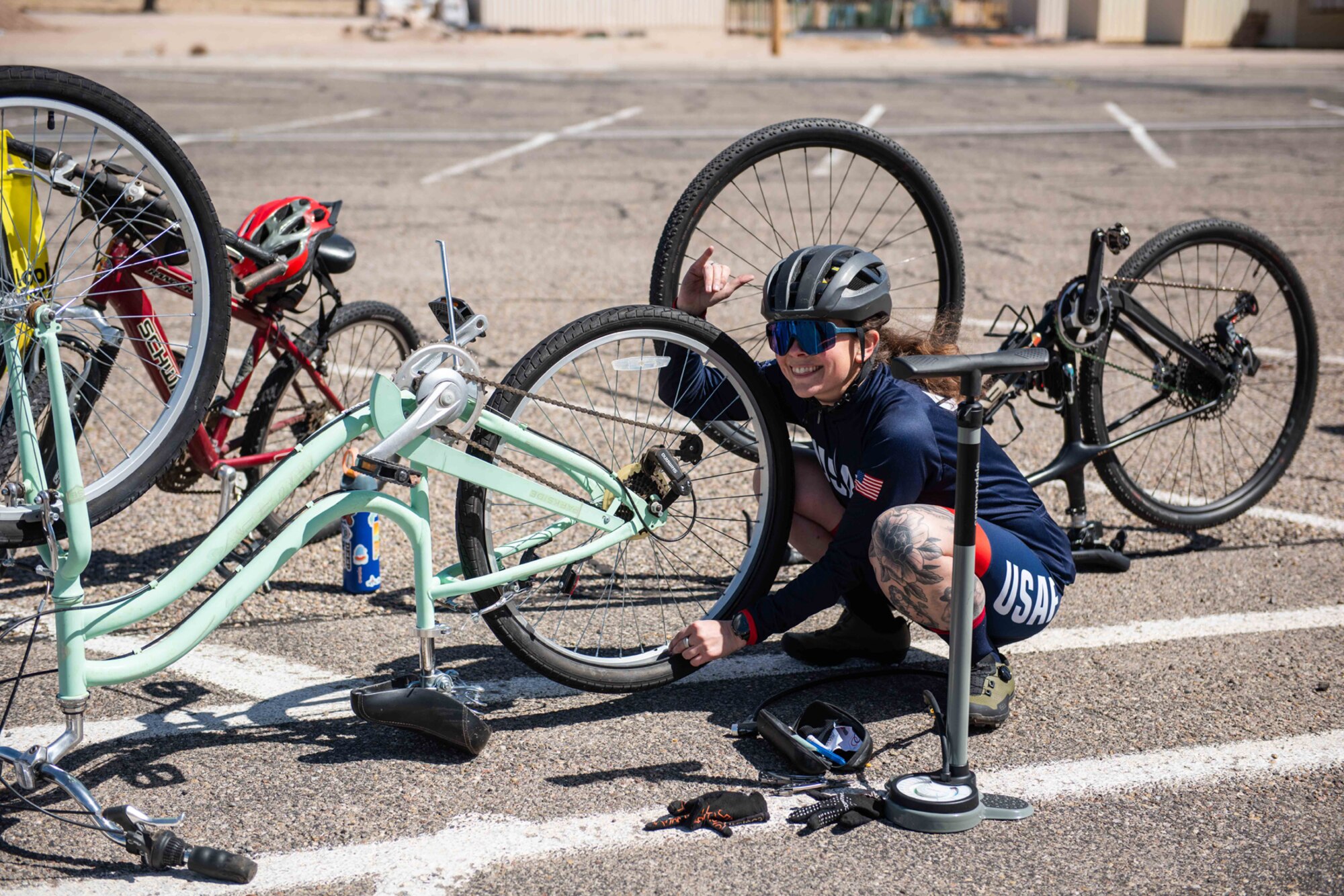 Woman fixes bike tire